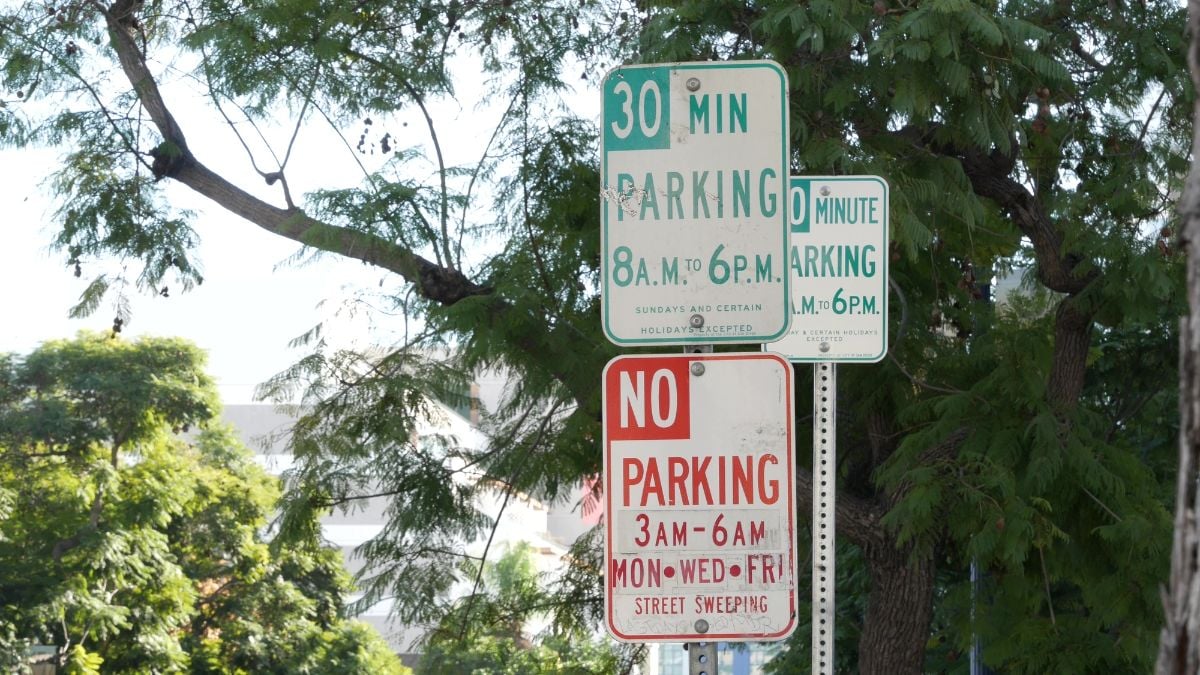 Stacked parking signs in downtown of San Diego, California.