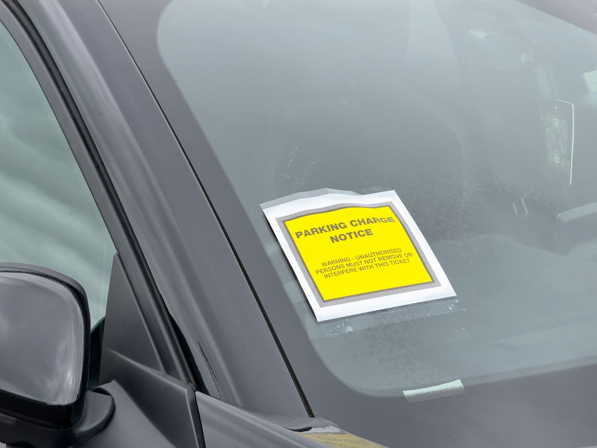 Parking charge notice attached to car which is parked illegally.