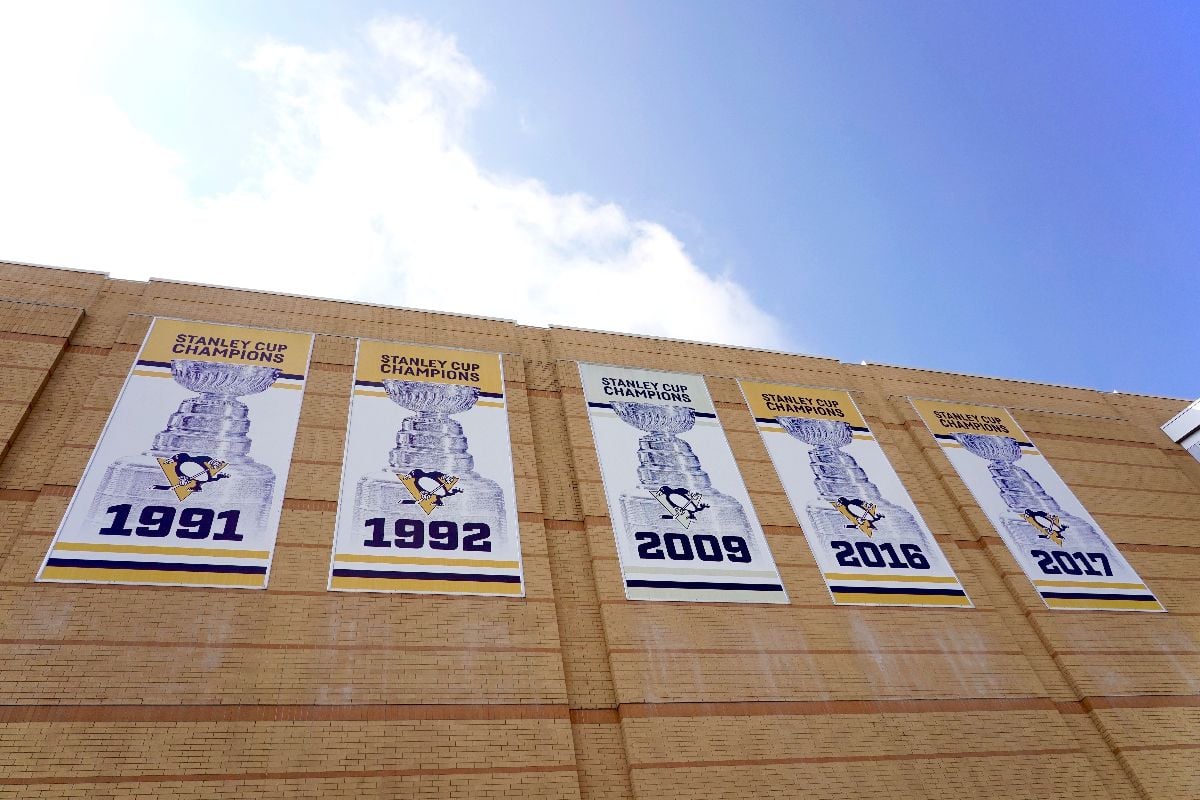 The PPG Paints Arena lined with trophy banners.