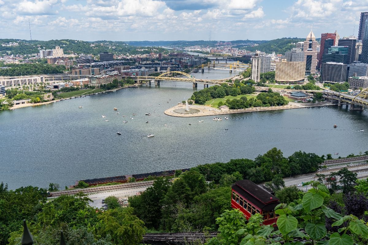Boats gather around The Point in downtown Pittsburgh on a warm summer day.