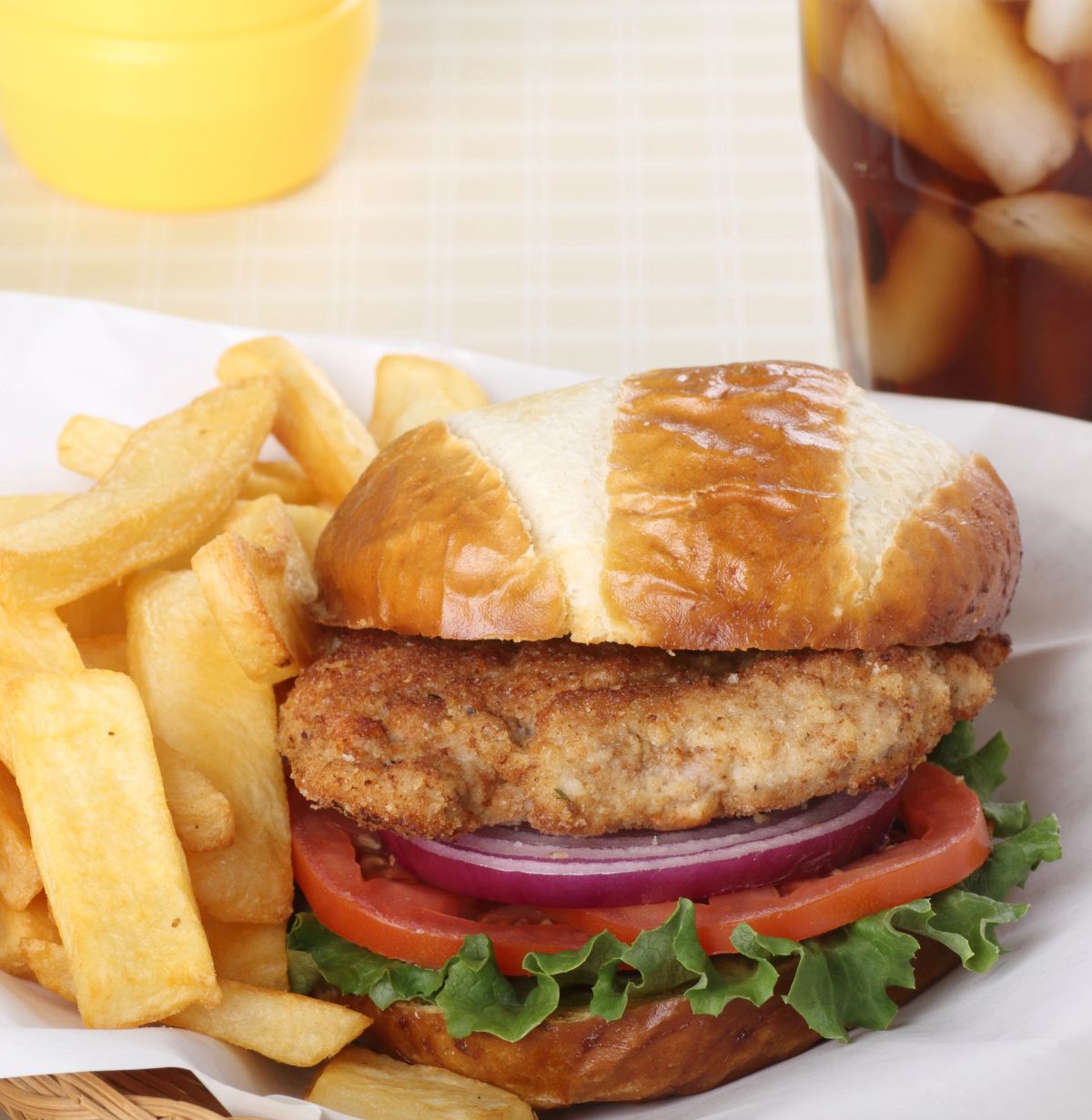 Pork tenderloin with french fries on the side.