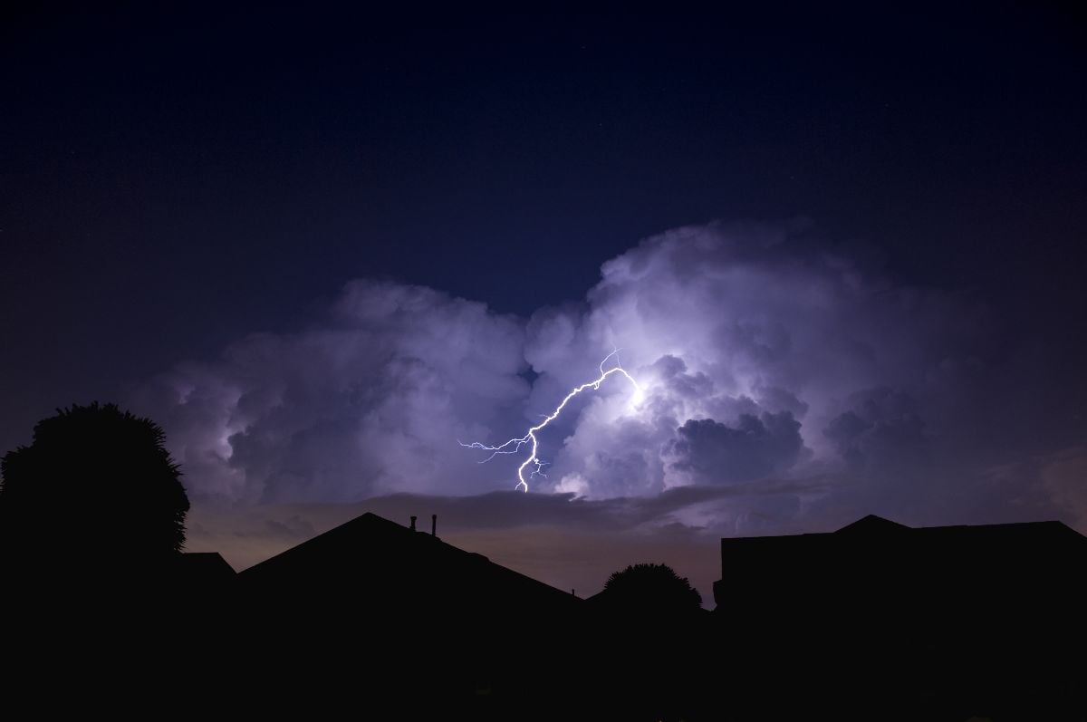 Lightning strike in a local neighborhood during a power outage.