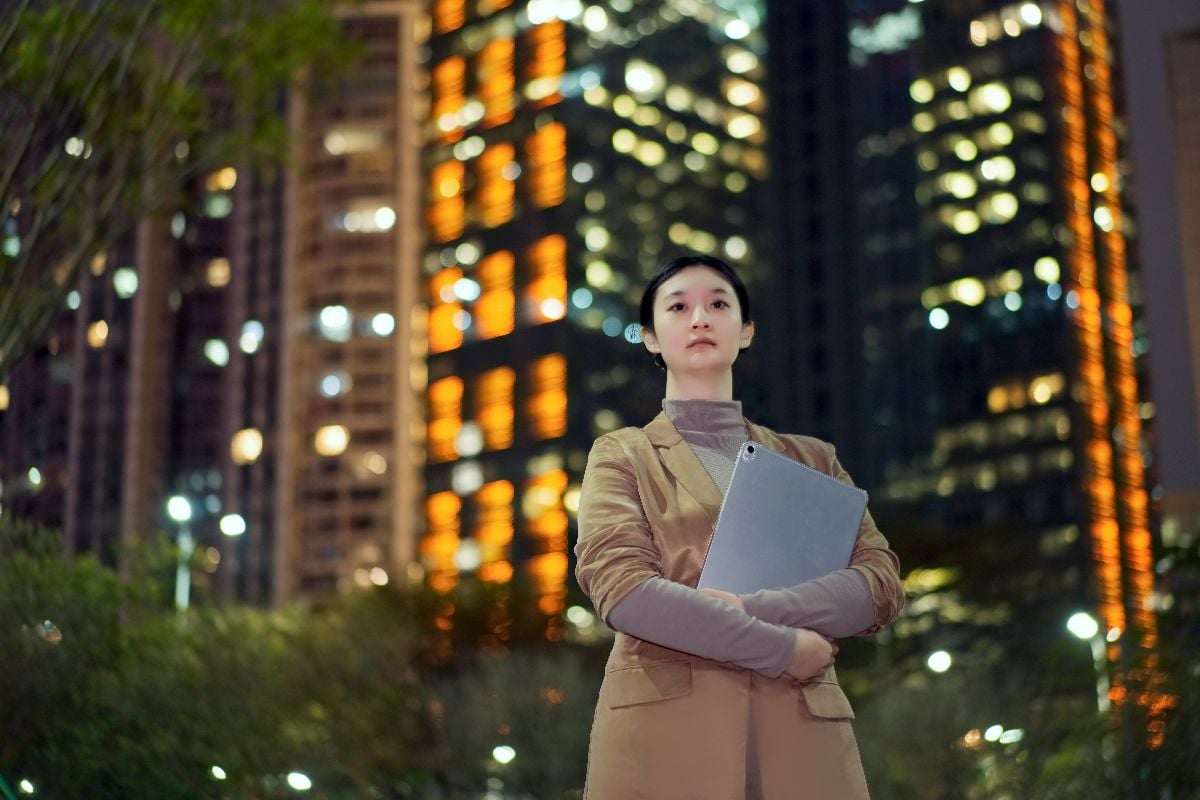 Confident professional in a bustling cityscape.