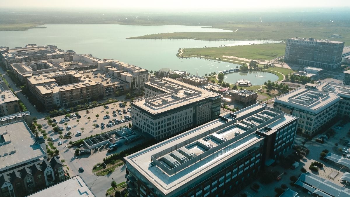 Buildings with rooftops and a view of the lake.