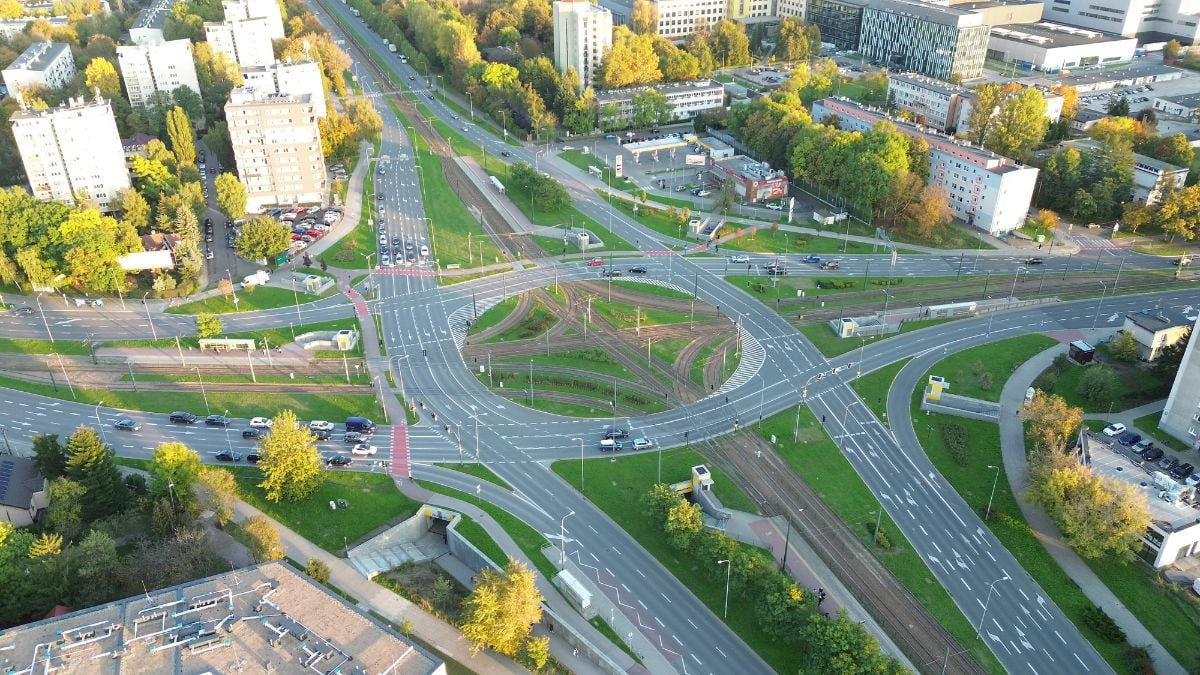 Residential neighborhood with roundabout in fall light.