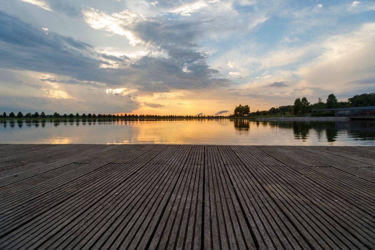 Sunset and reflections on the water on Patriot Lake in Shelby Farms Park.