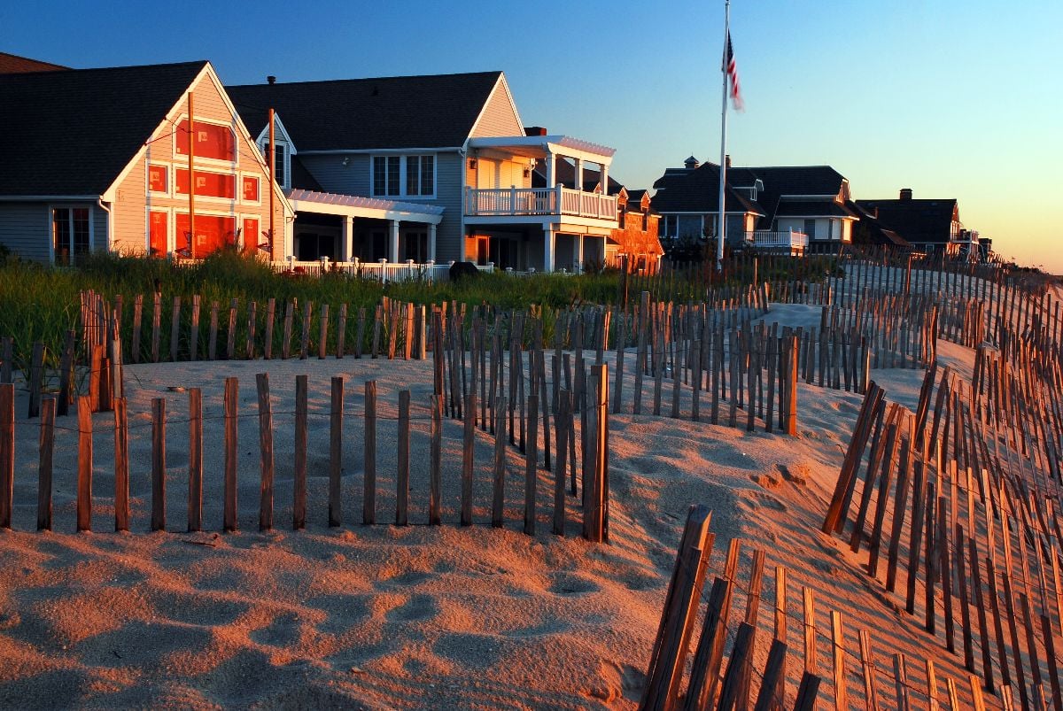 Snow fences near shore houses.
