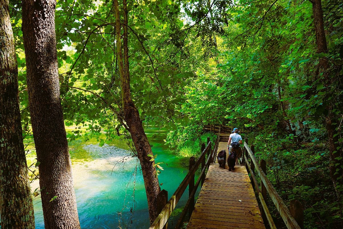 A hiker enjoying the Spring trail and lookout trail at Ha Ha Tonka State Park Missouri.
