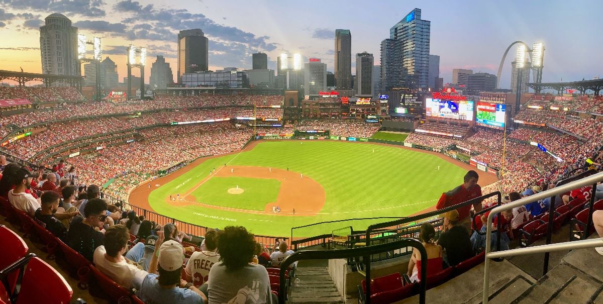St Louis Cardinals stadium during a summer game around sunset.