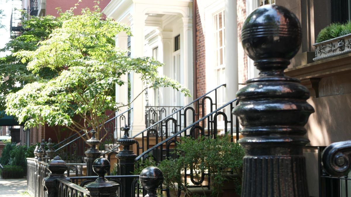 Front stoop with wrought iron railings.
