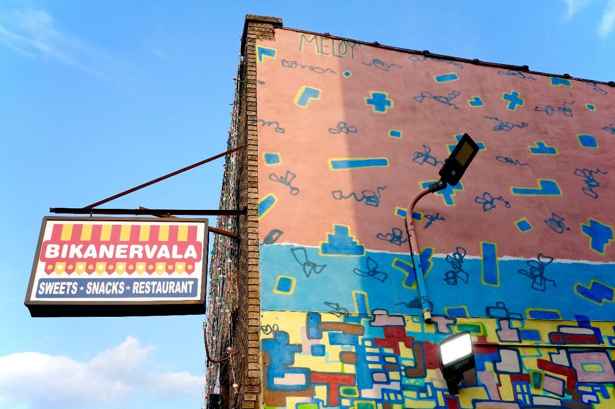 The Newark Avenue commercial district with its muralled restaurant.