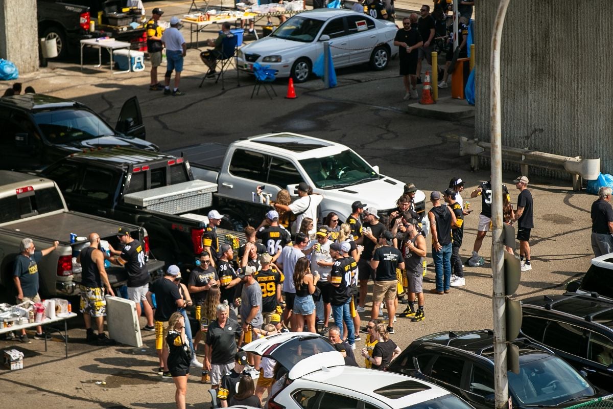 Pittsburgh Steeler fans tailgate in the parking lots outside of Acrisure stadium.