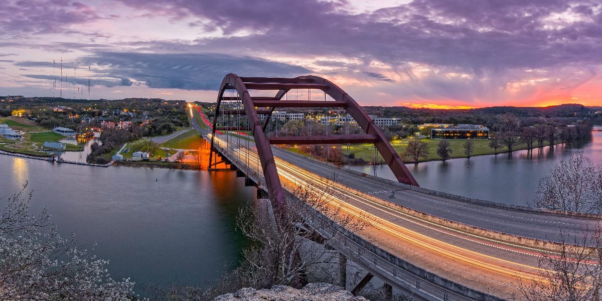 Twilight panorama of Pennybacker Bridge 360 over Lake Austin.