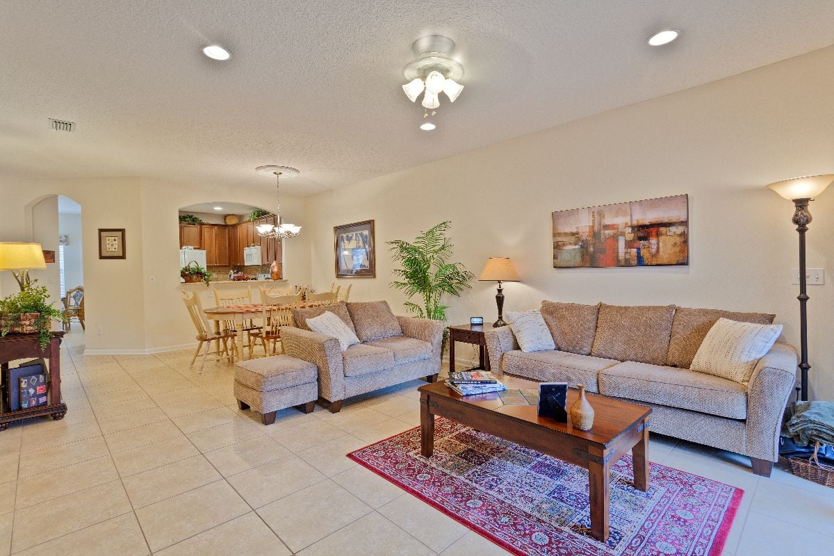Open concept living room with tiled flooring.