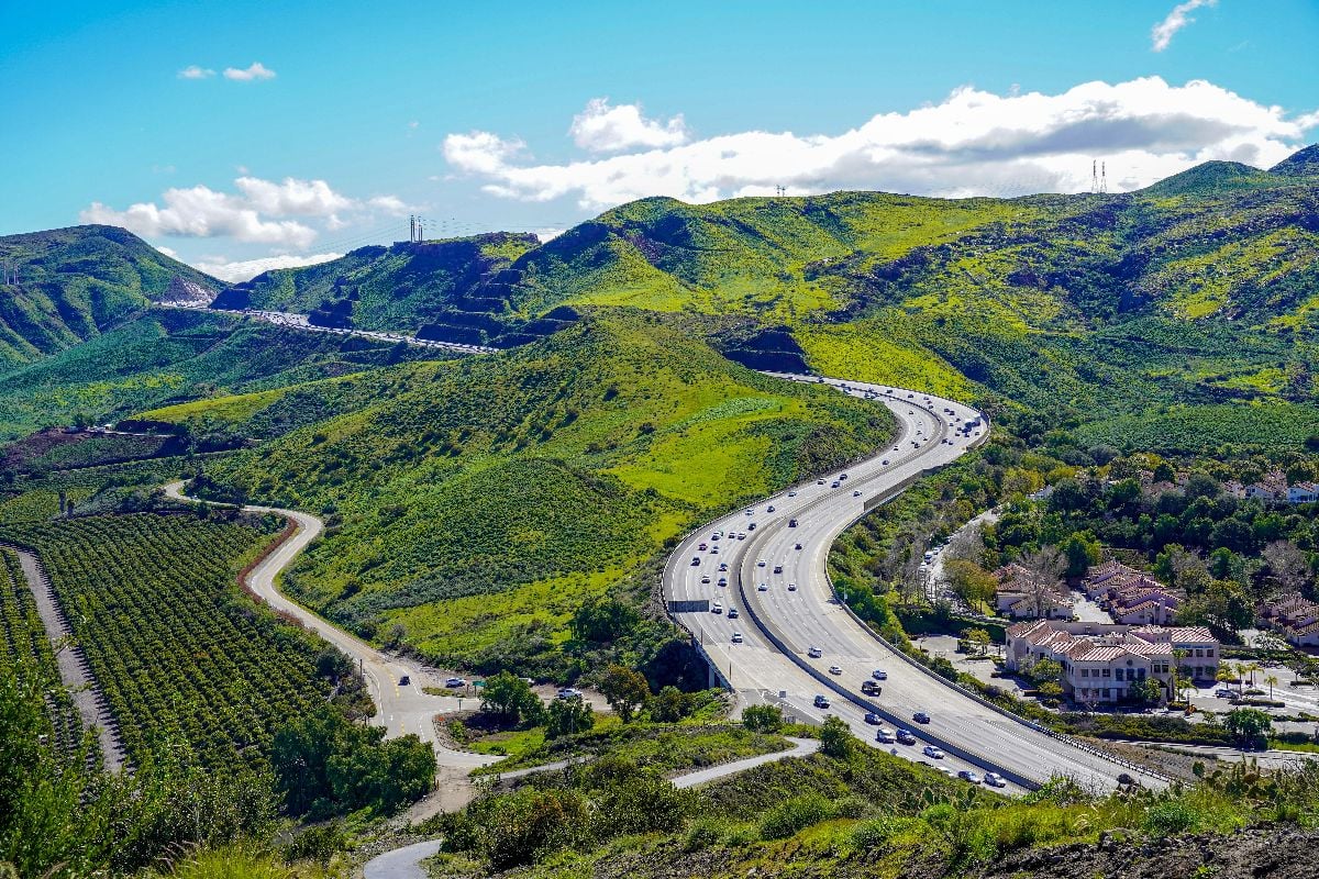 Panoramic 101 Ventura Highway in Southern California winding through green hills and valleys from Thousand Oaks to Northern California.