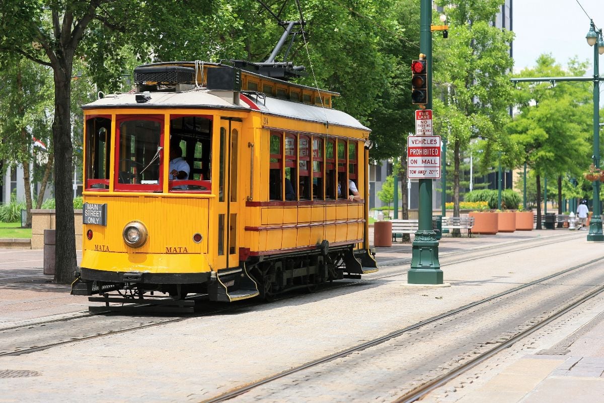 A yellow electric trolley on Main Street in downtown Memphis.