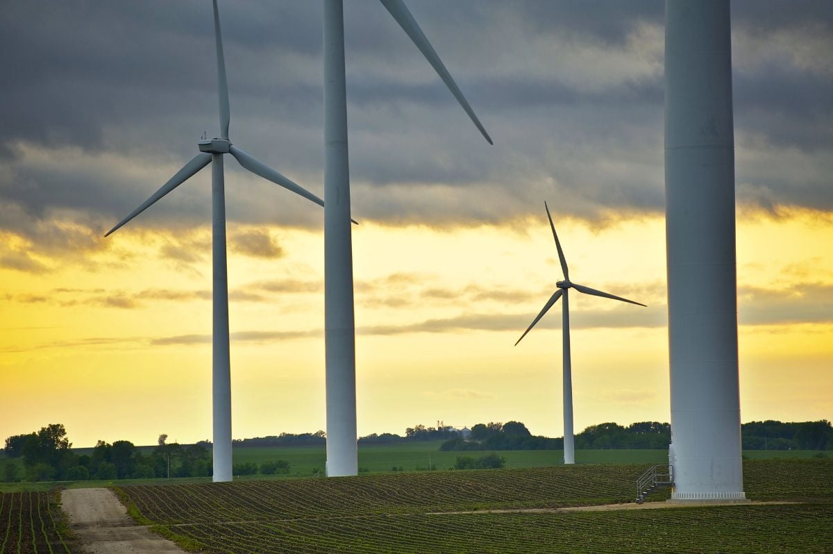 Wind energy against the amber sky.