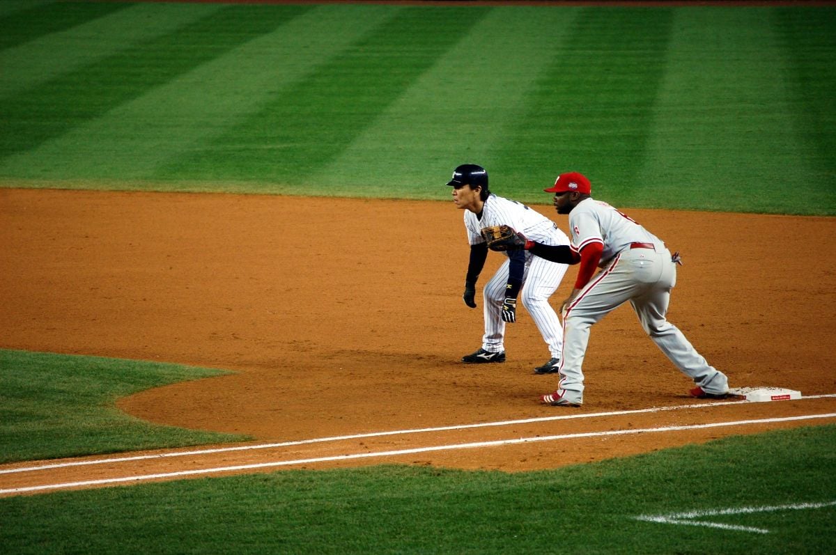 Hideki Matsui of the Yankees leads off first base as Ryan Howard of the Phillies covers during game 2 of the World Series.