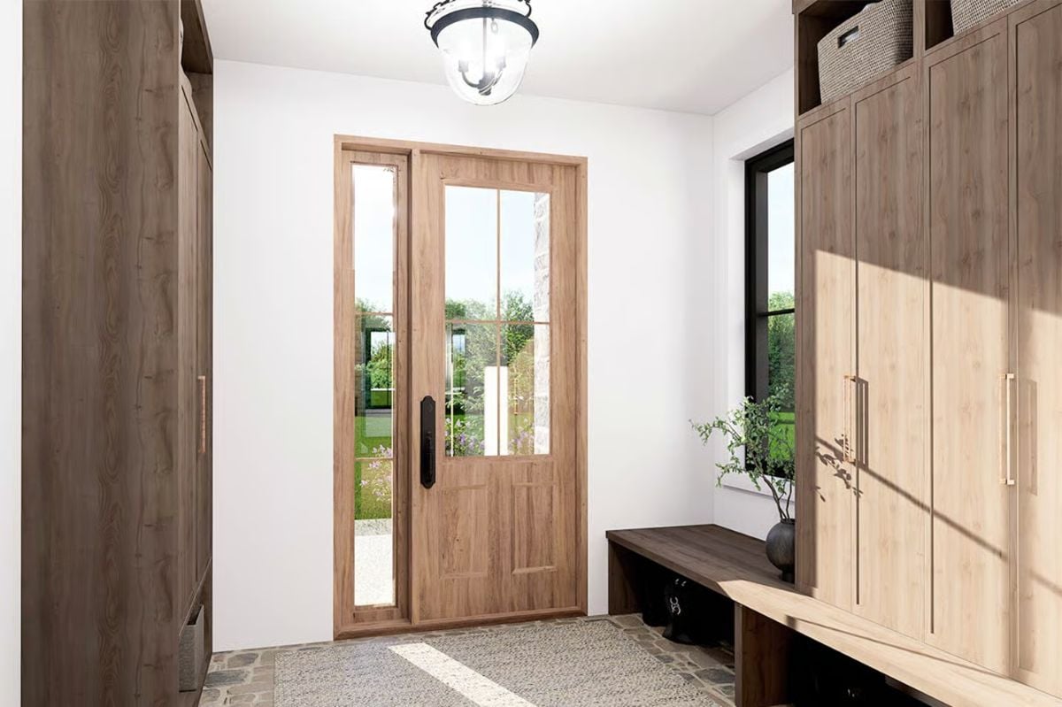 Glass Sidelights and Transoms Frame the Entry Door in Natural Light