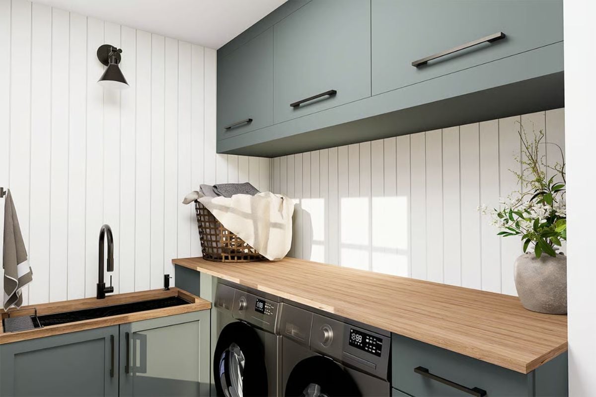 Sage Green Cabinets and Wood Counters Turn a Laundry Room Into Usable Space