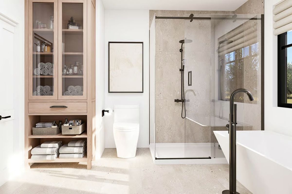 Frameless Glass and Black Hardware Carve Out a Shower That Feels Open Yet Defined