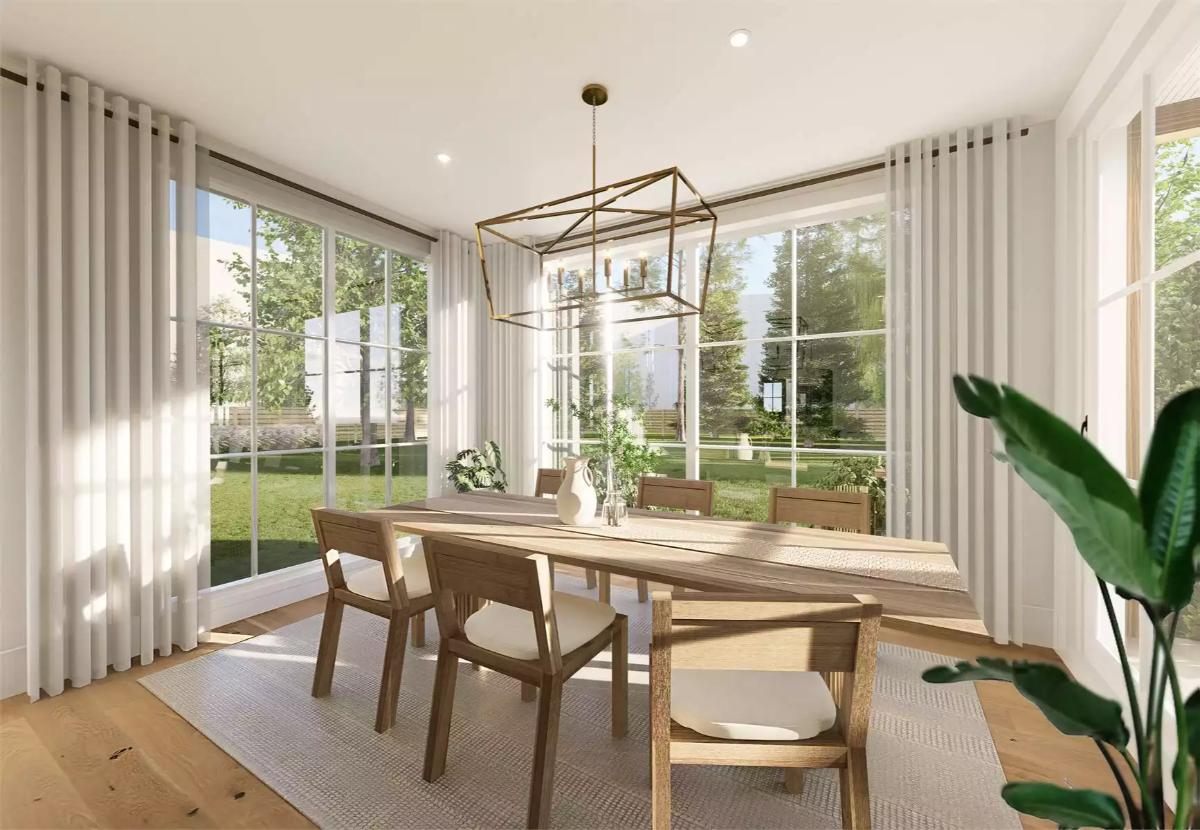 A Geometric Brass Chandelier Anchors the Dining Table Without Blocking Sightlines