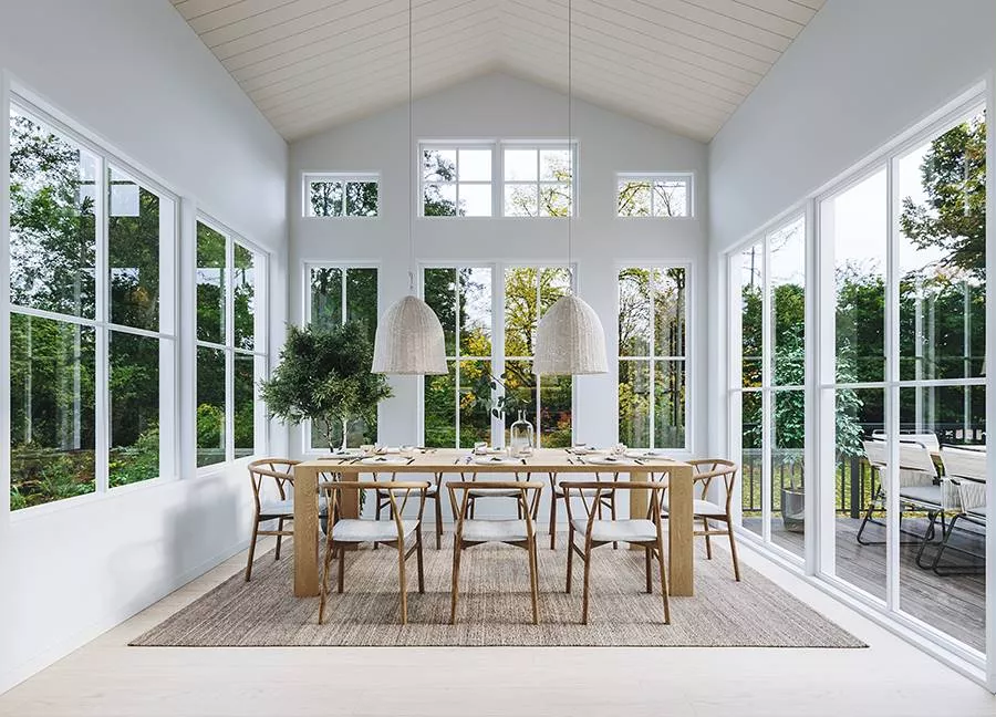 Vaulted Ceilings and Floor-to-Ceiling Windows Turn This Dining Room Into a Treehouse
