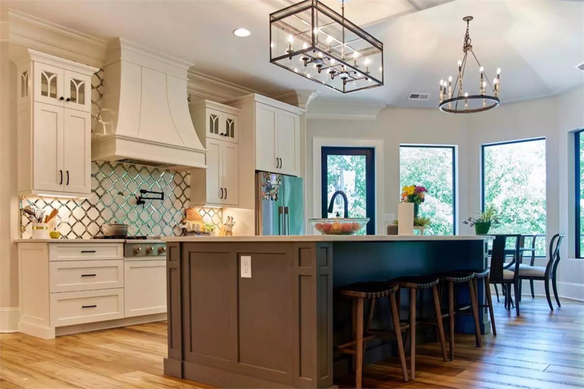 Kitchen with Quatrefoil Tile Backsplash and Two-Tone Cabinetry
