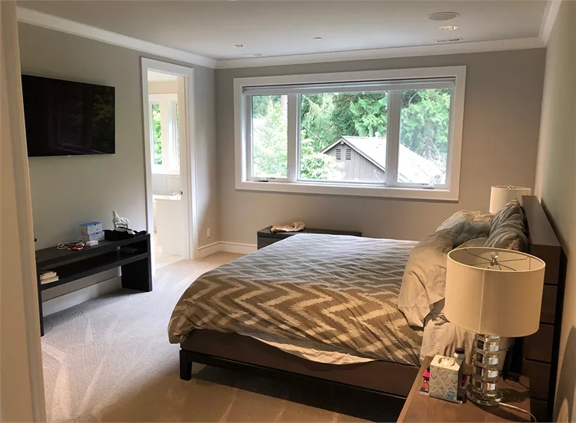 Serene Master Bedroom with Carpet Flooring and Private Ensuite Access