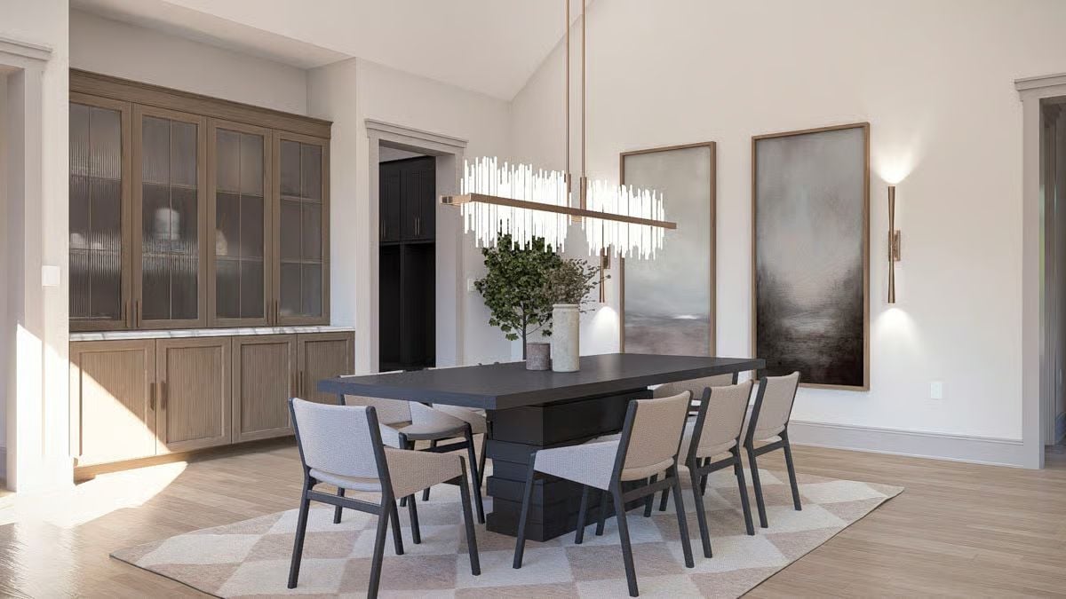 A Linear Chandelier Mimics the Table's Length and Centers the Dining Zone