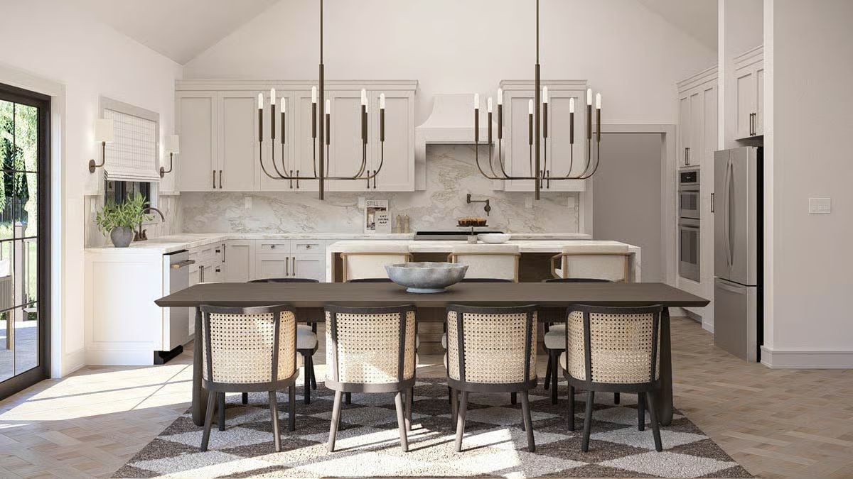 Two Chandeliers and Marble Define a Kitchen Built for Symmetry and Presence