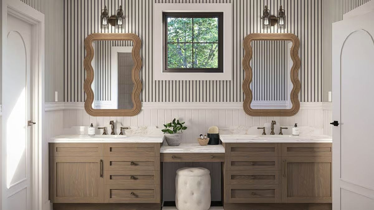 Vertical Striped Wallpaper and Dual Mirrors Create Symmetry in a Shared Bath