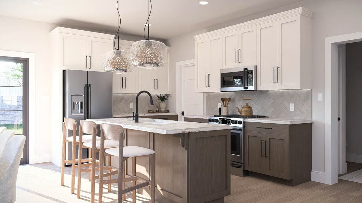 Bright Kitchen with Two-Tone Cabinetry and Herringbone Backsplash