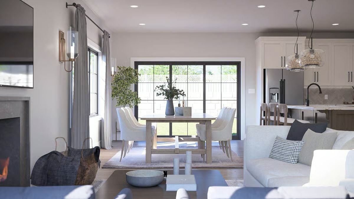 Open-Concept Living and Dining Area with Black-Framed Glass Doors