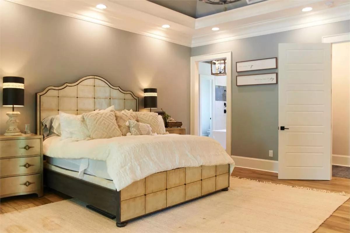 Primary Bedroom with Mirrored Headboard and Tray Ceiling Detail