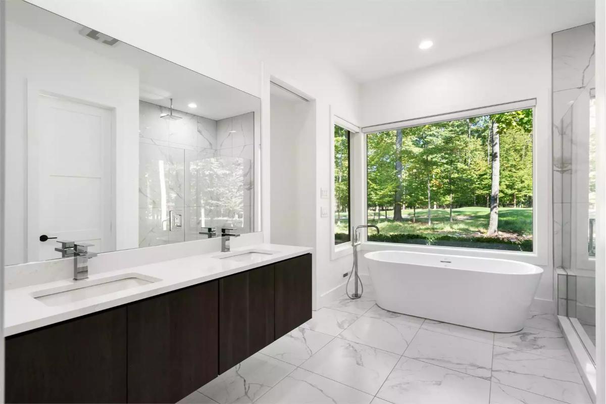 Spa-Inspired Master Bath with Freestanding Tub and Forest Views