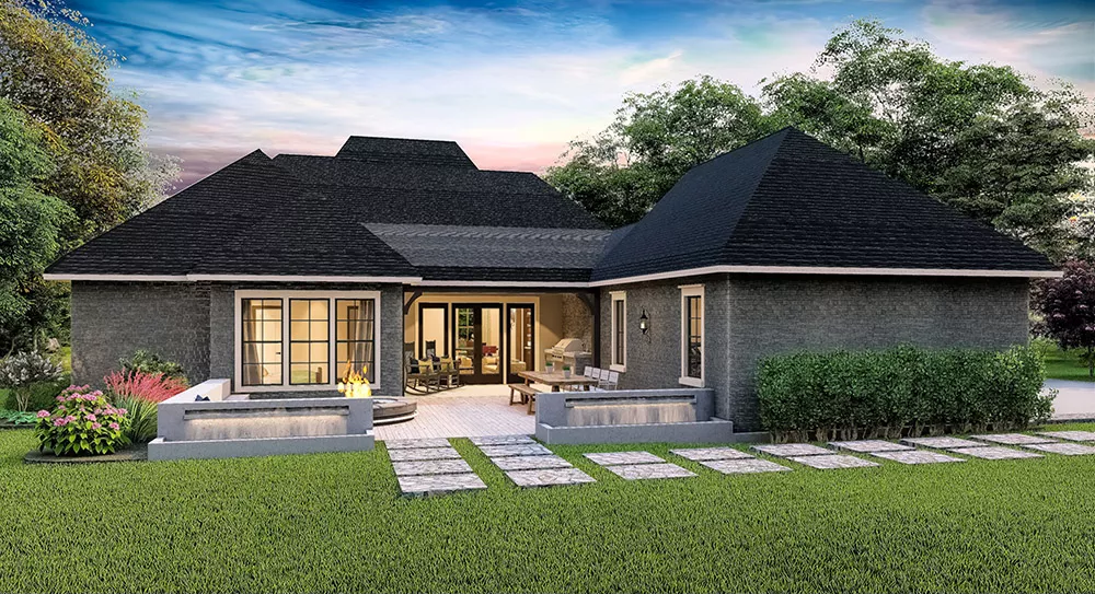 Sunset Glow Illuminates Dark Brick Exterior with Hip Roof Design