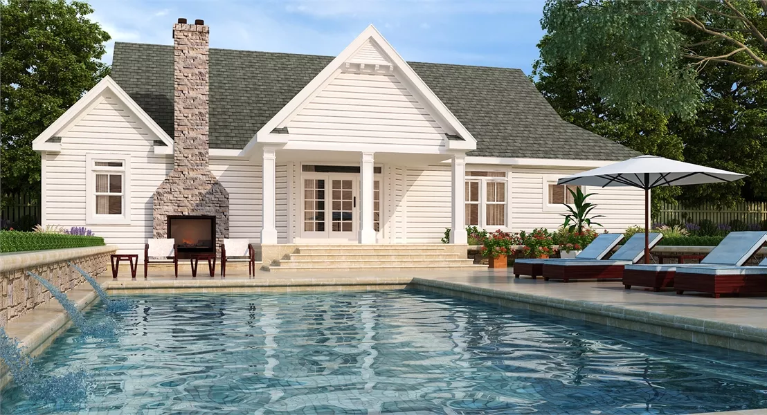 Poolside Patio with Outdoor Fireplace and Lounge Chairs