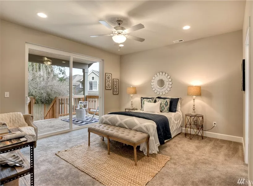 Spacious Master Bedroom with Sliding Glass Doors to Private Balcony