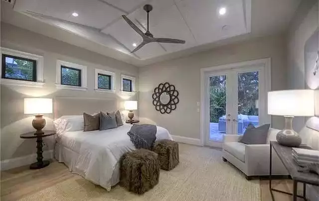 Primary Bedroom with Tray Ceiling and French Doors to Outdoor Patio
