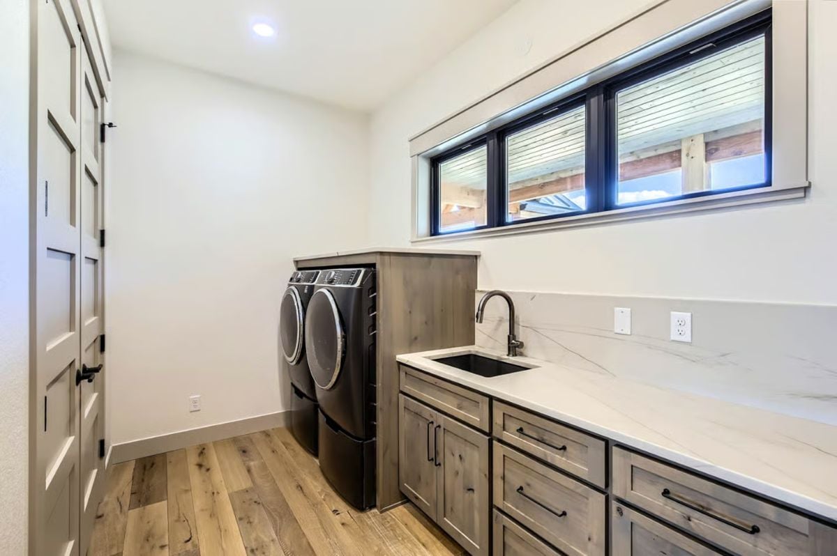 Laundry Room with Gray Cabinetry and White Quartz Countertops
