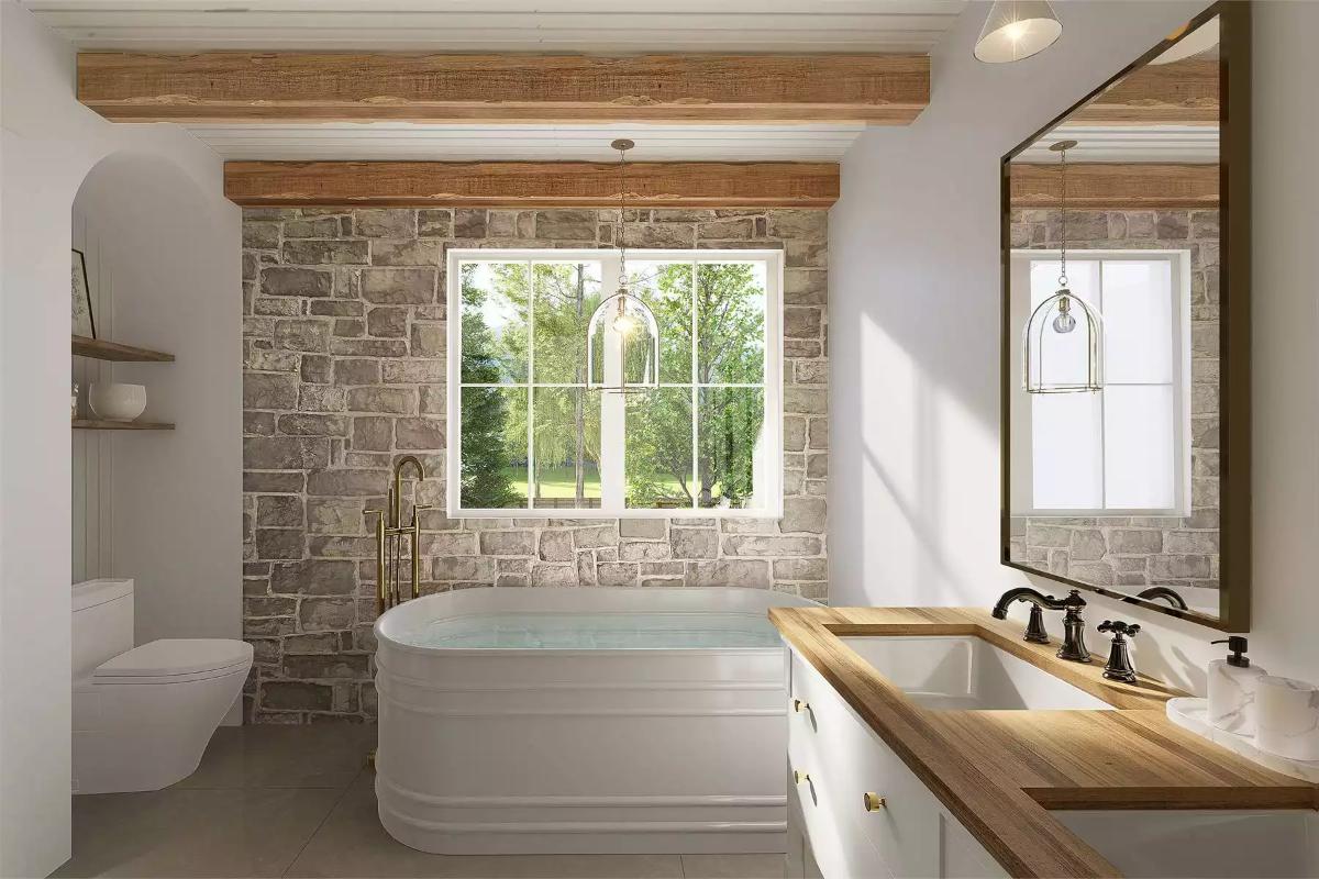 Stone Wall Wraps the Tub Alcove So the View Stays Framed and Protected