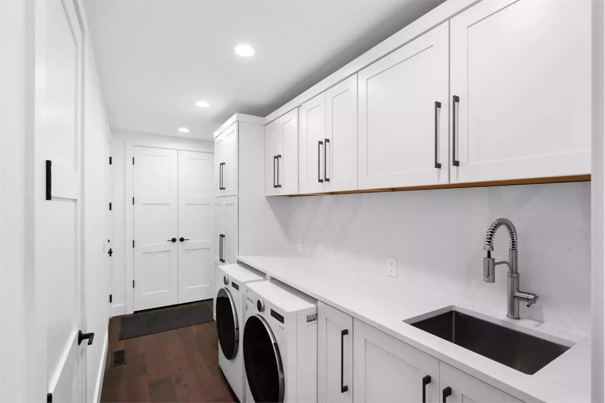 Laundry Room with Undermount Sink and Full-Height Storage Cabinets