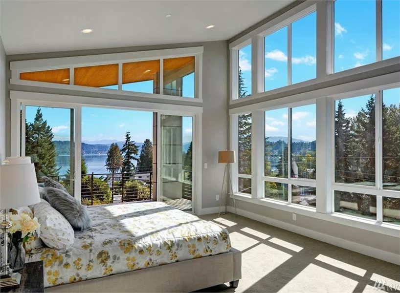 Master Bedroom with Floor-to-Ceiling Windows and Water Views