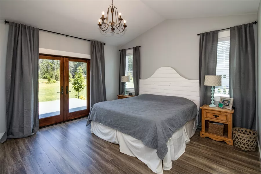 Master Bedroom with French Doors Opening to Backyard Patio