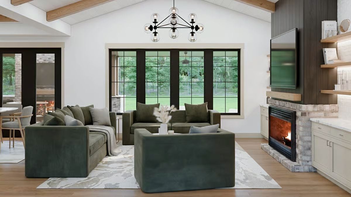 Open Living Room with Forest Views and Modern Fireplace