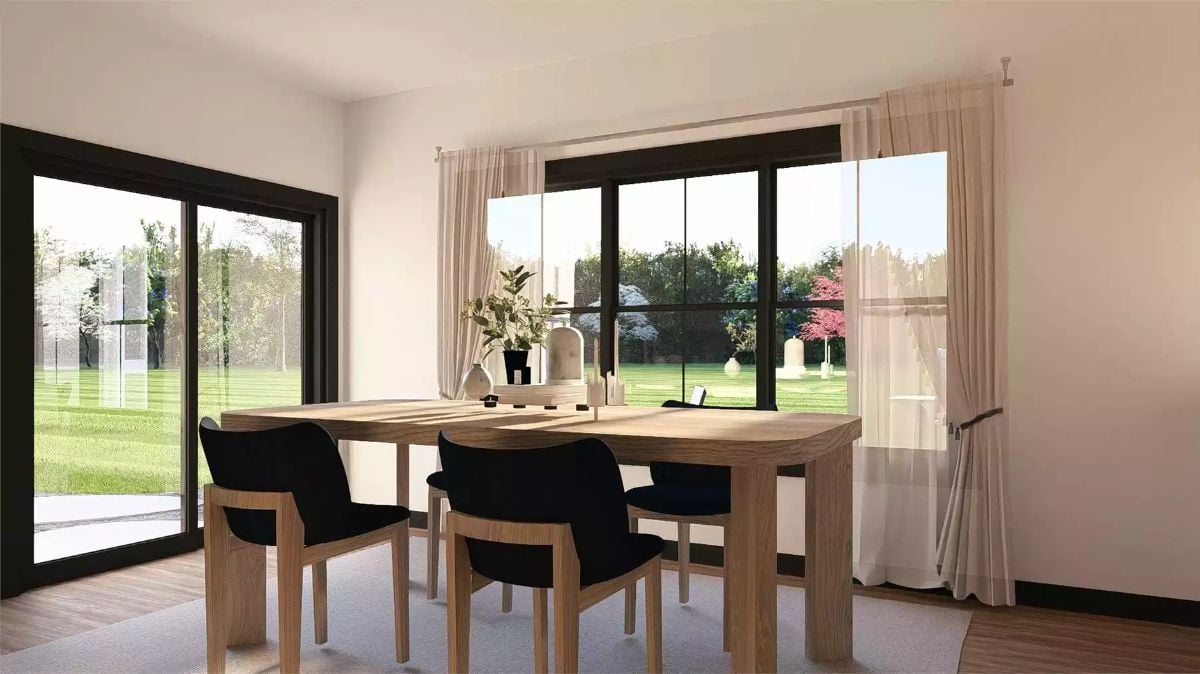 Dining Area Framed by Floor-to-Ceiling Black Windows and Sheer Curtains