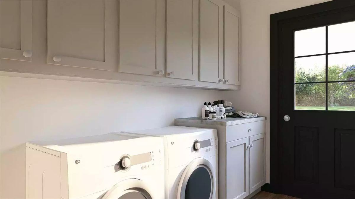 Laundry Room with Shaker Cabinets and Front-Load Washer and Dryer