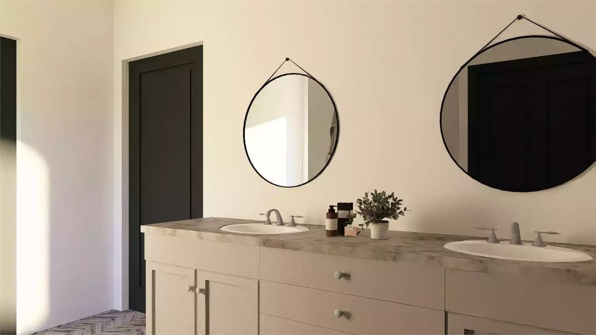 Double Vanity Bathroom with Circular Hanging Mirrors and Marble Countertops