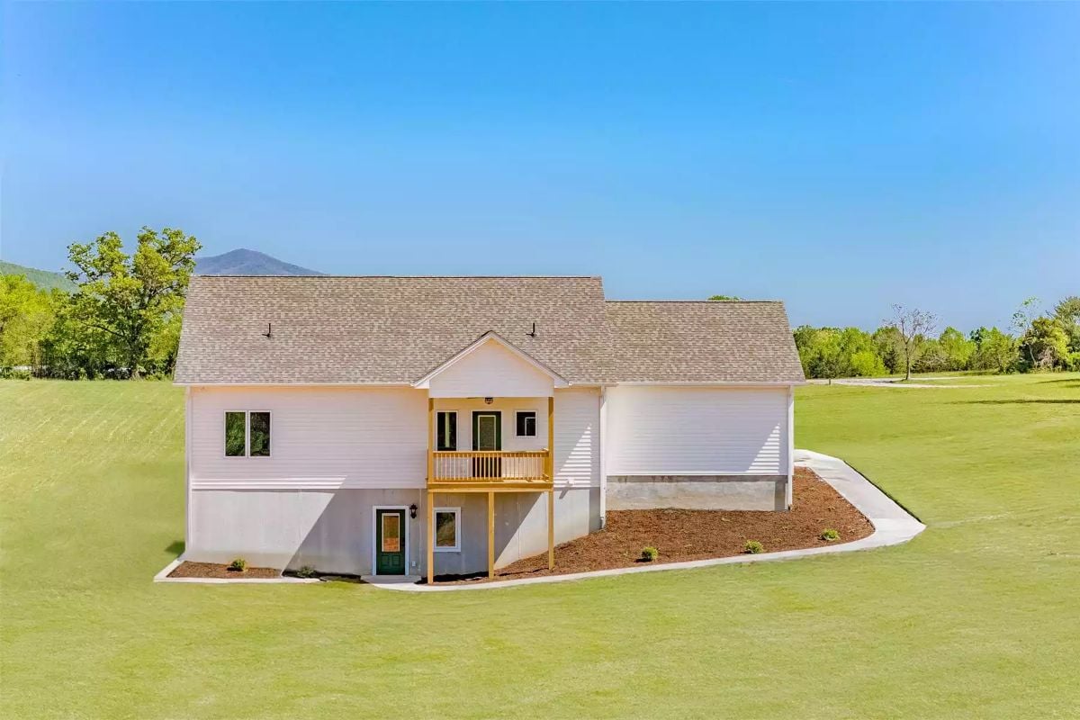 Pink Siding and Open Lawn Create a Fresh Farmhouse Look